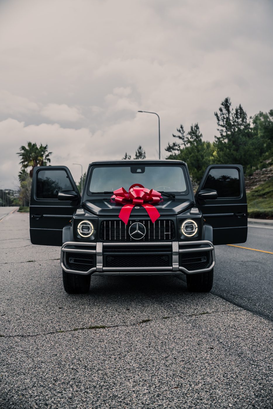 Mercedes-AMG G63 delivery with red bow, doors open